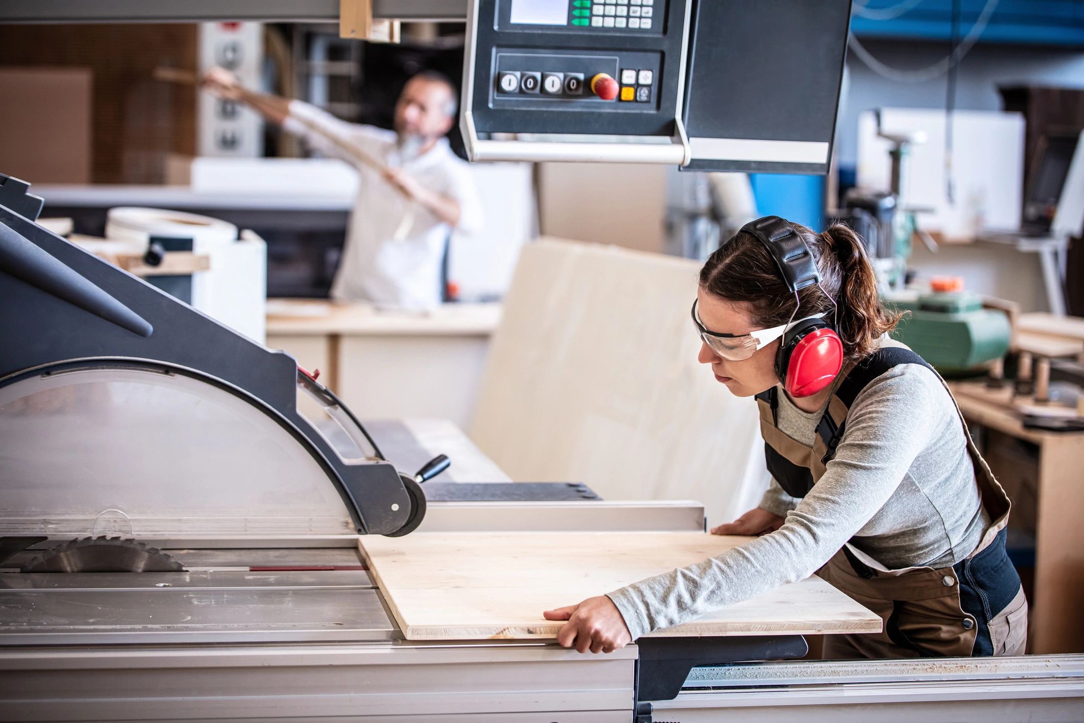 Craftspeople working together in a woodworking shop