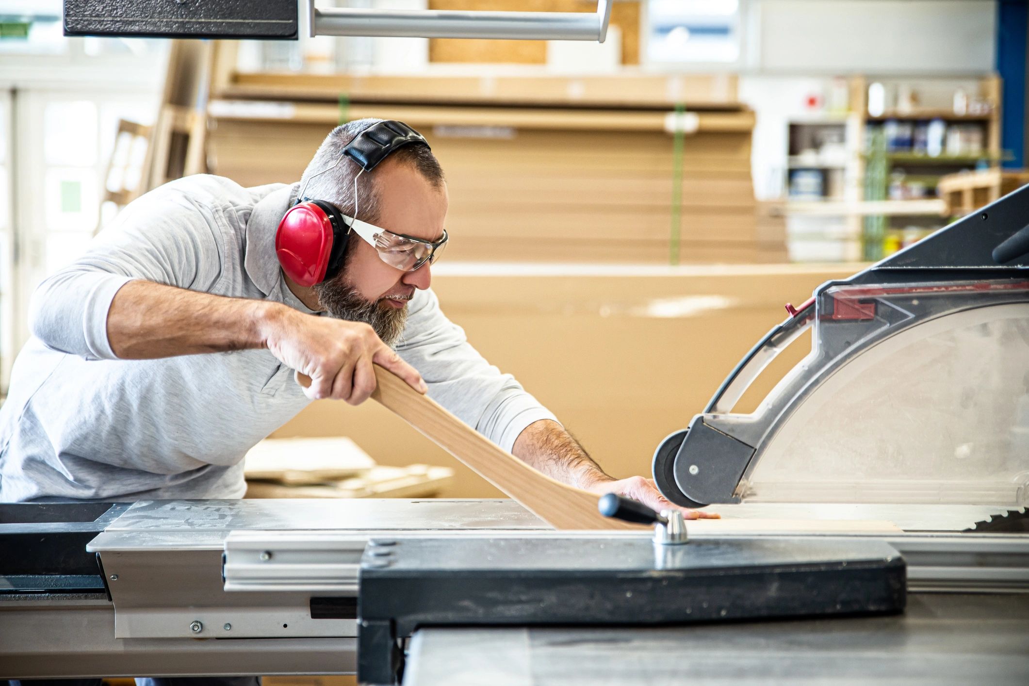 Cabinet maker cutting wood in a workshop