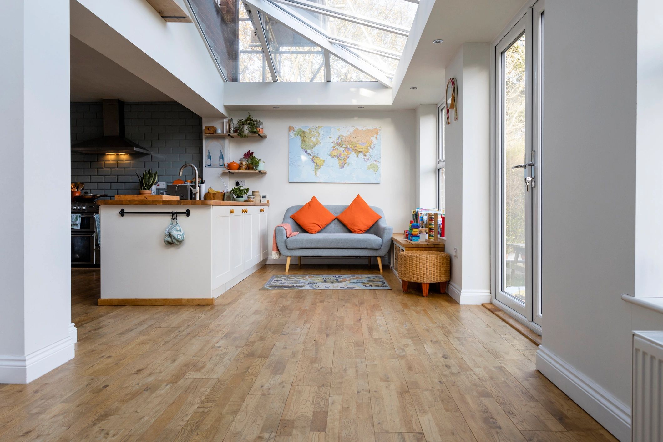 Modern open plan kitchen with wood flooring