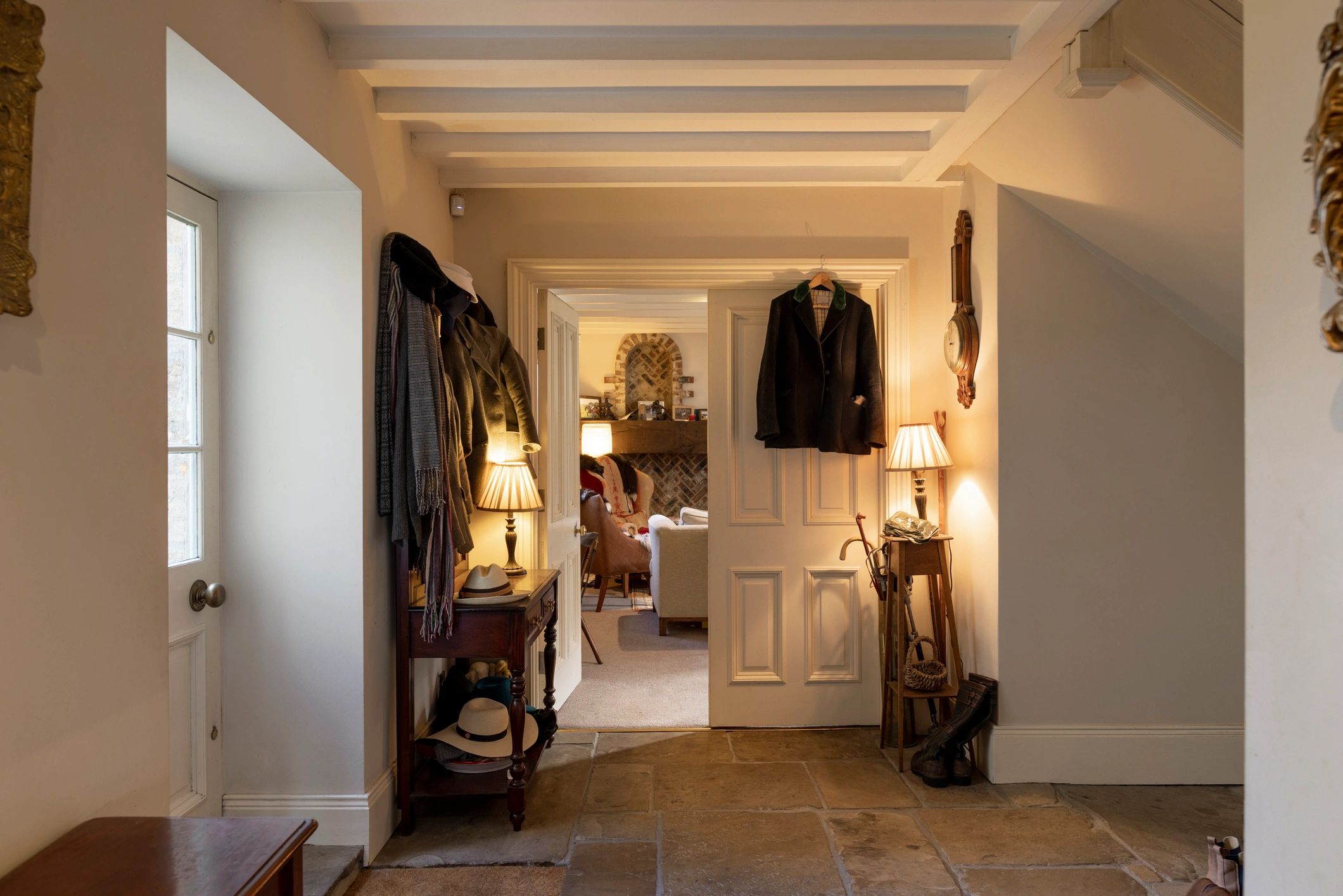 Warm, welcoming entry hall with refined lighting and finishes