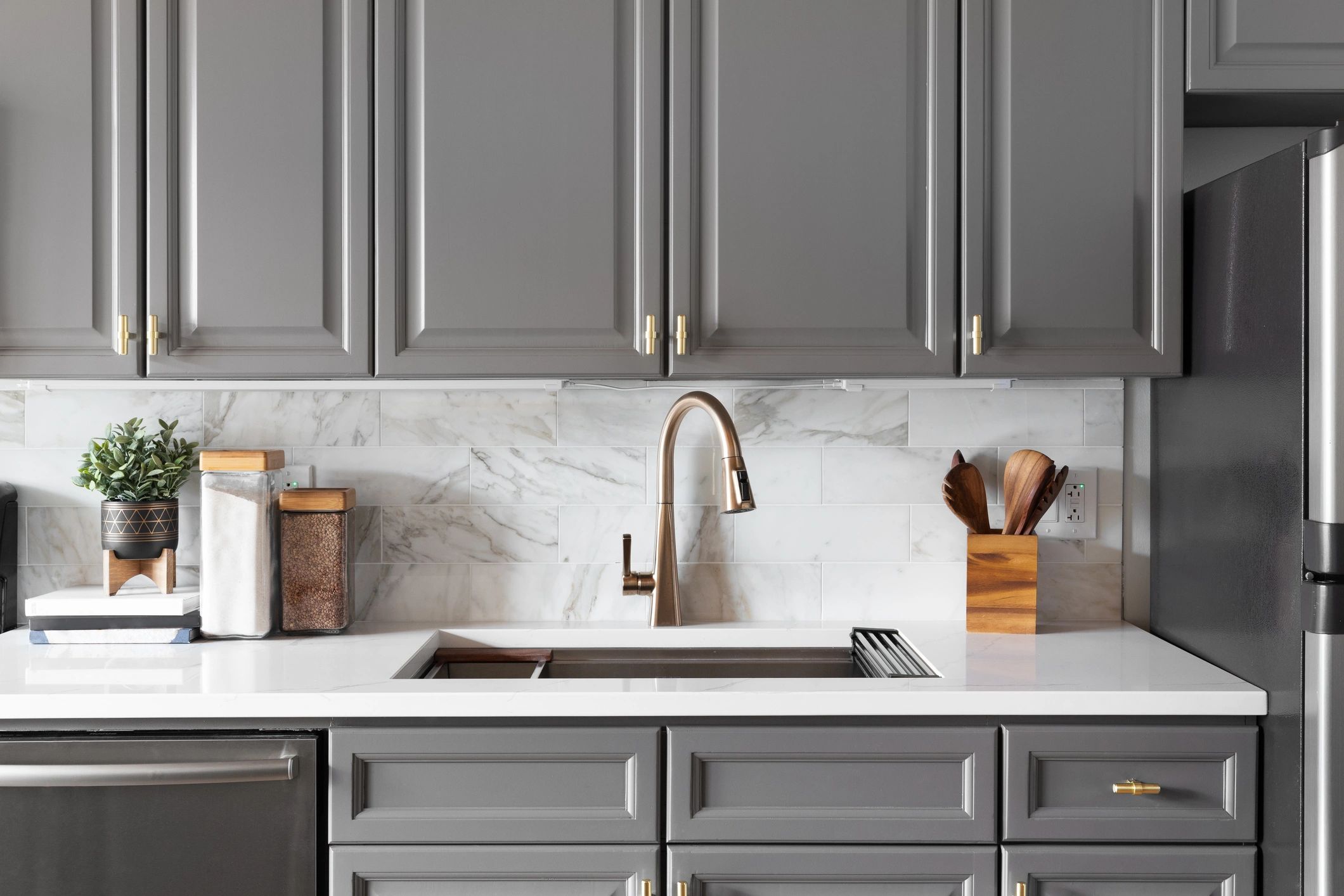 Close-up of kitchen faucet and cabinet hardware