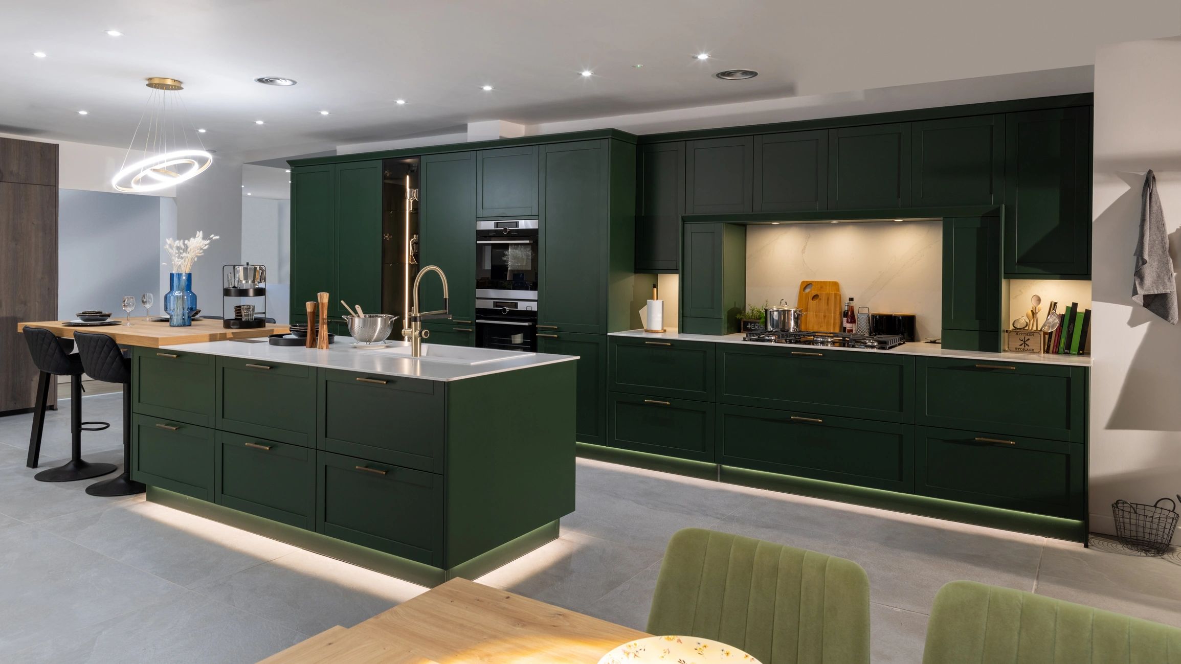 Elegant finished kitchen with island and bar stools