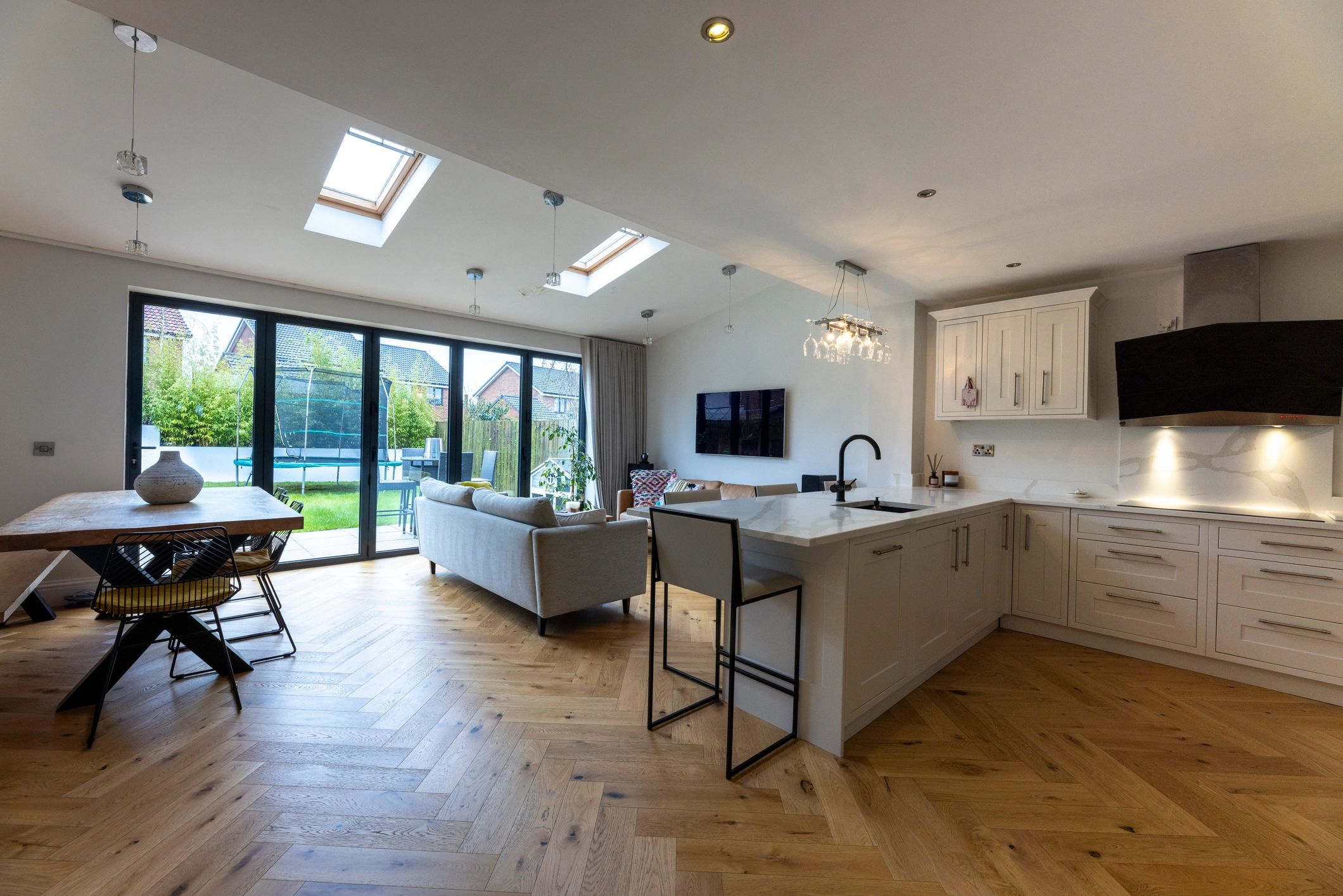 Open plan kitchen and living space with custom cabinetry
